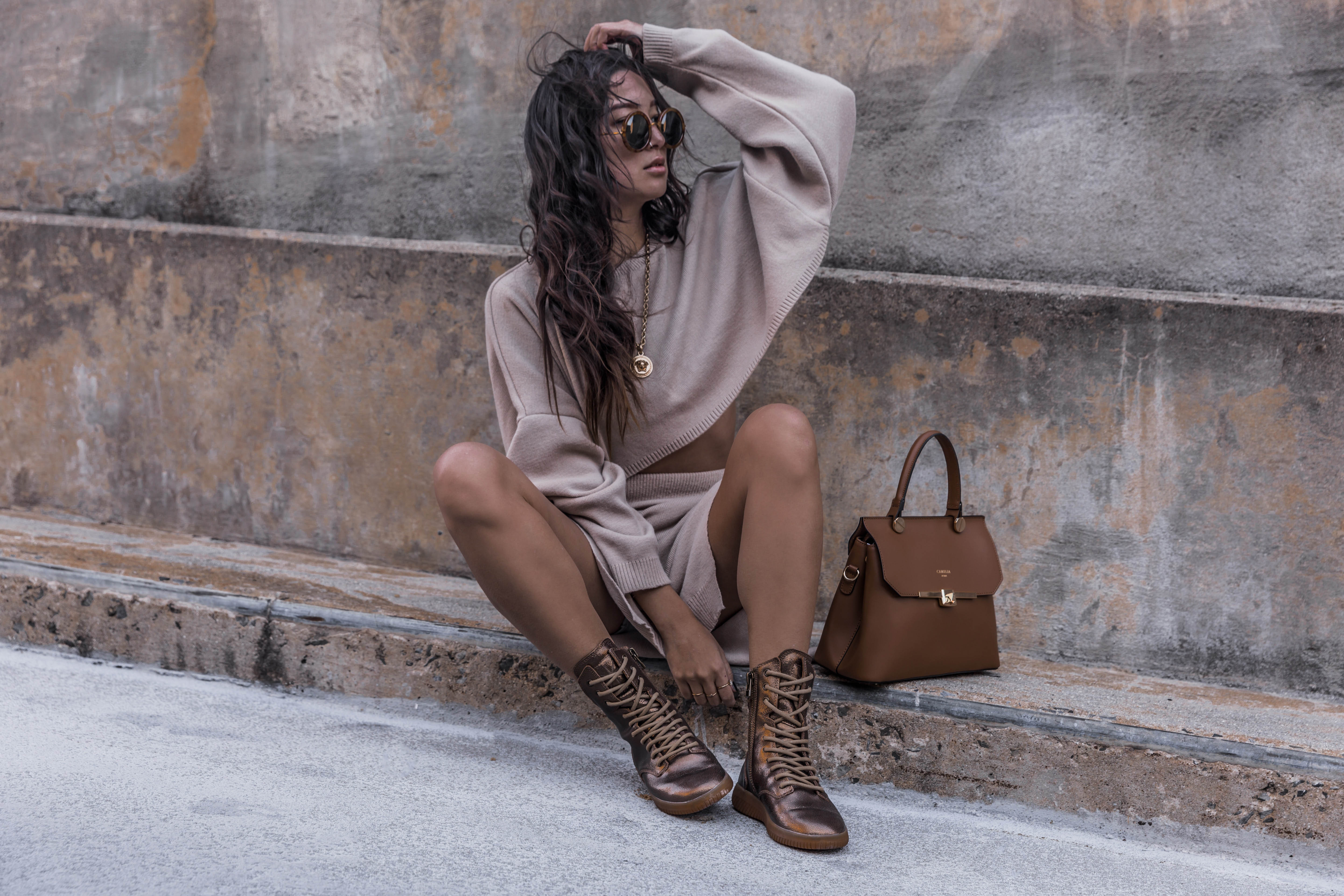 Person sits on steps in summer