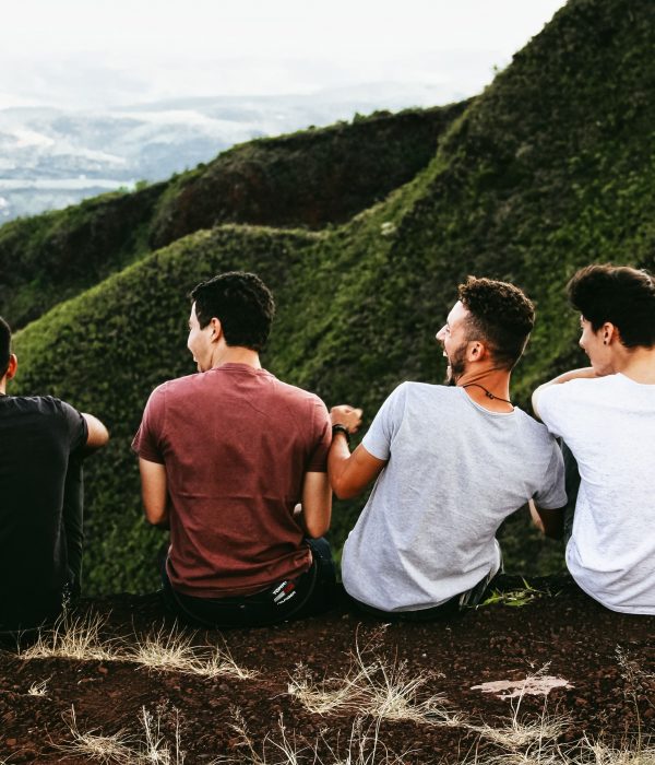 Four guys sat laughing together.