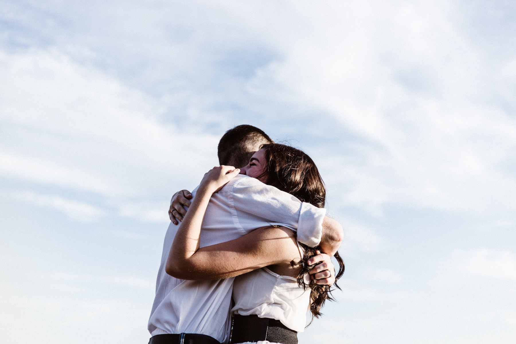 Two friends share a hug.