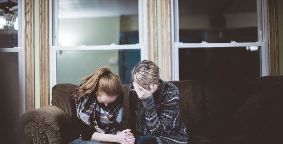 two, people, holding, hands, upset, crying, covering face