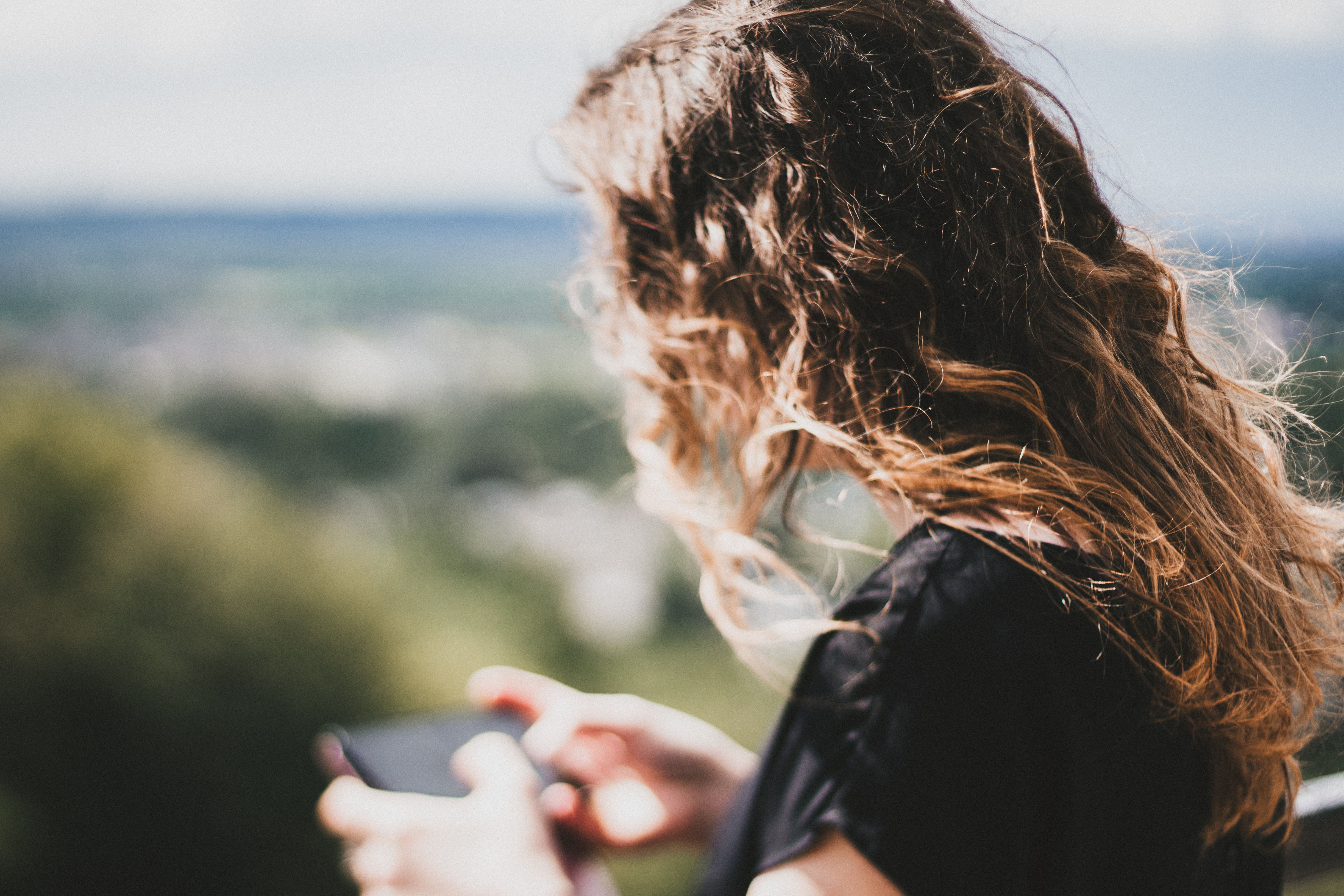 Woman on phone in field